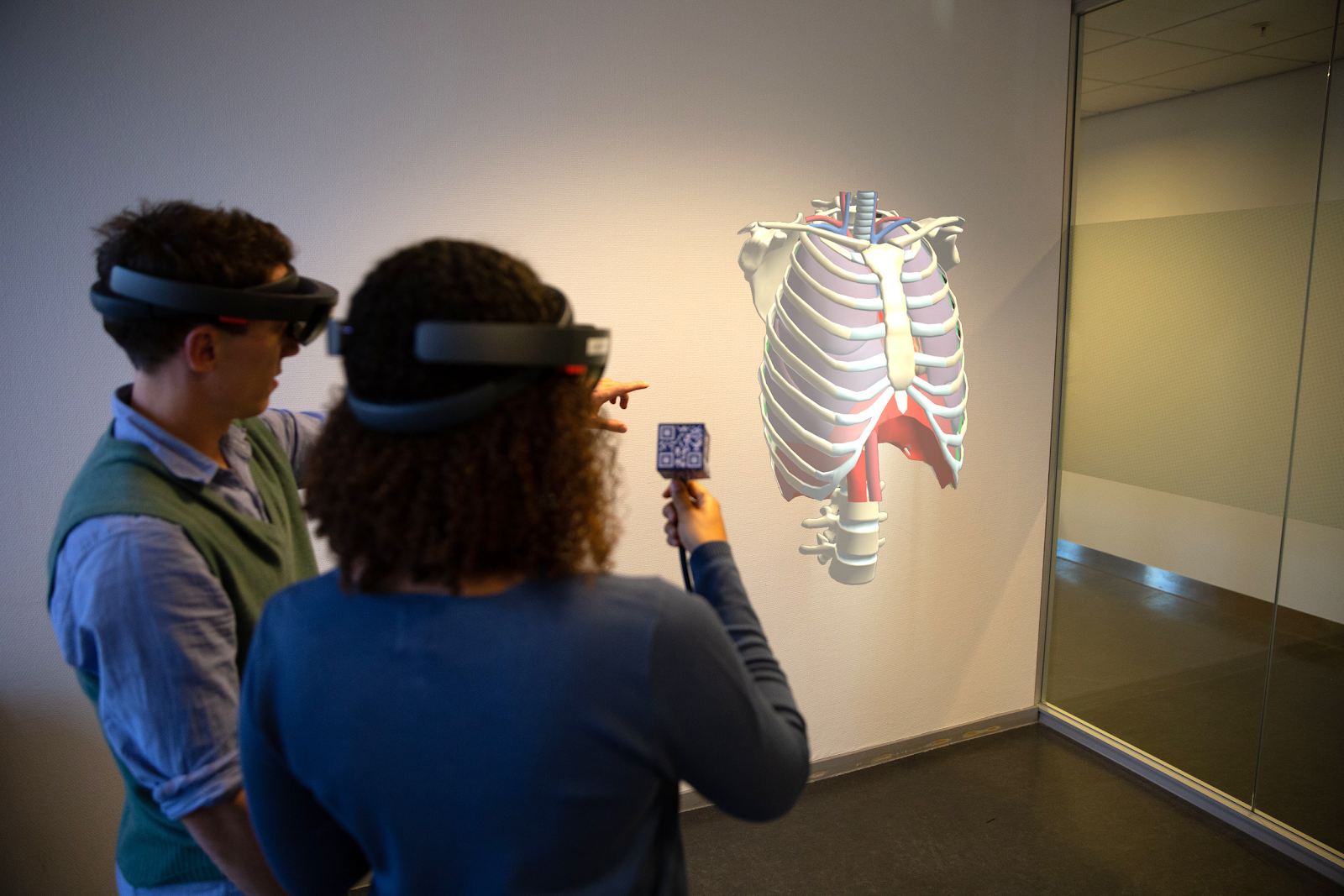 By using a real stethoscope that is being tracked by the HoloLens, students can interact with the virtual torso