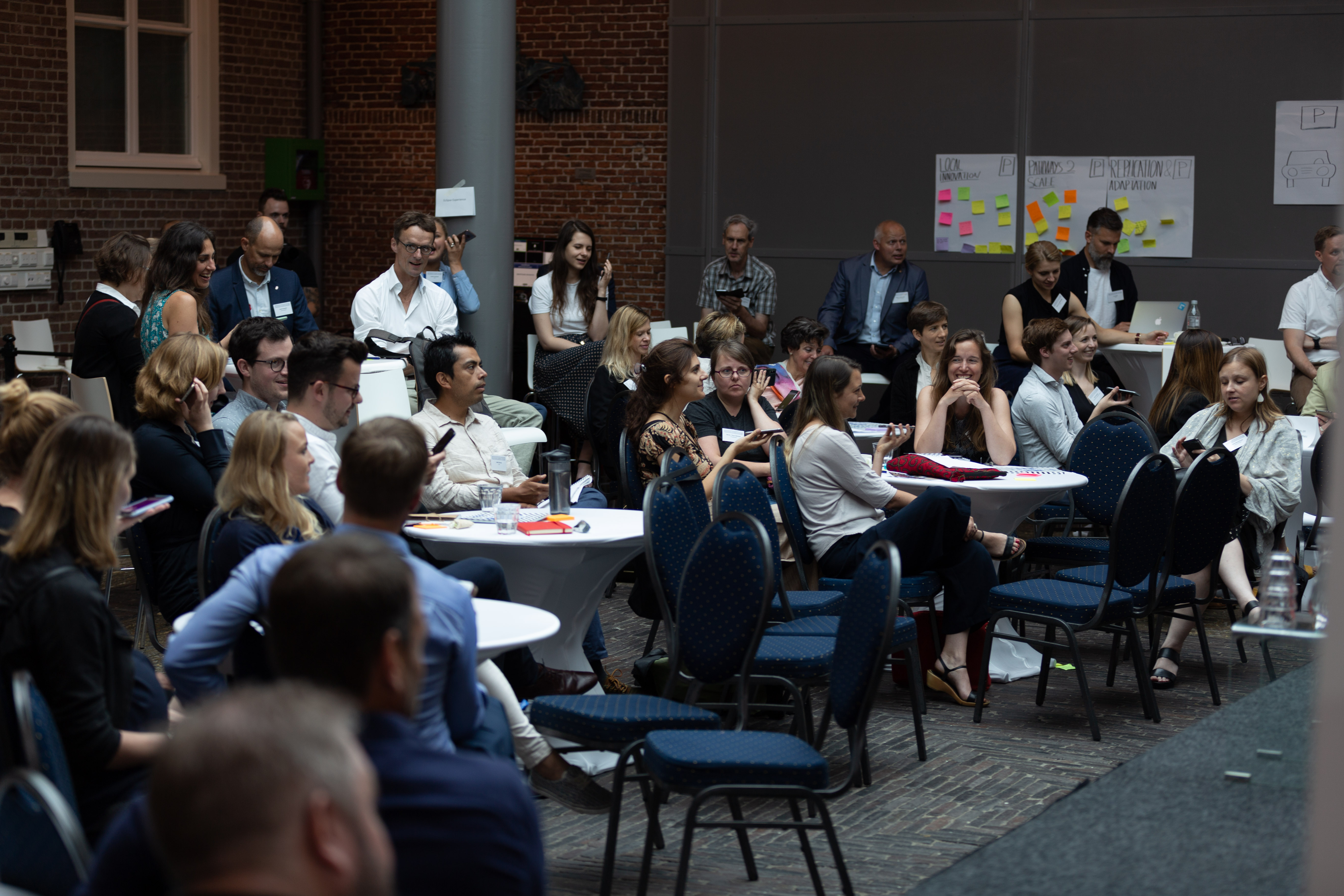 Attendees participating in an energising 'smartphone orchestra' during HIX